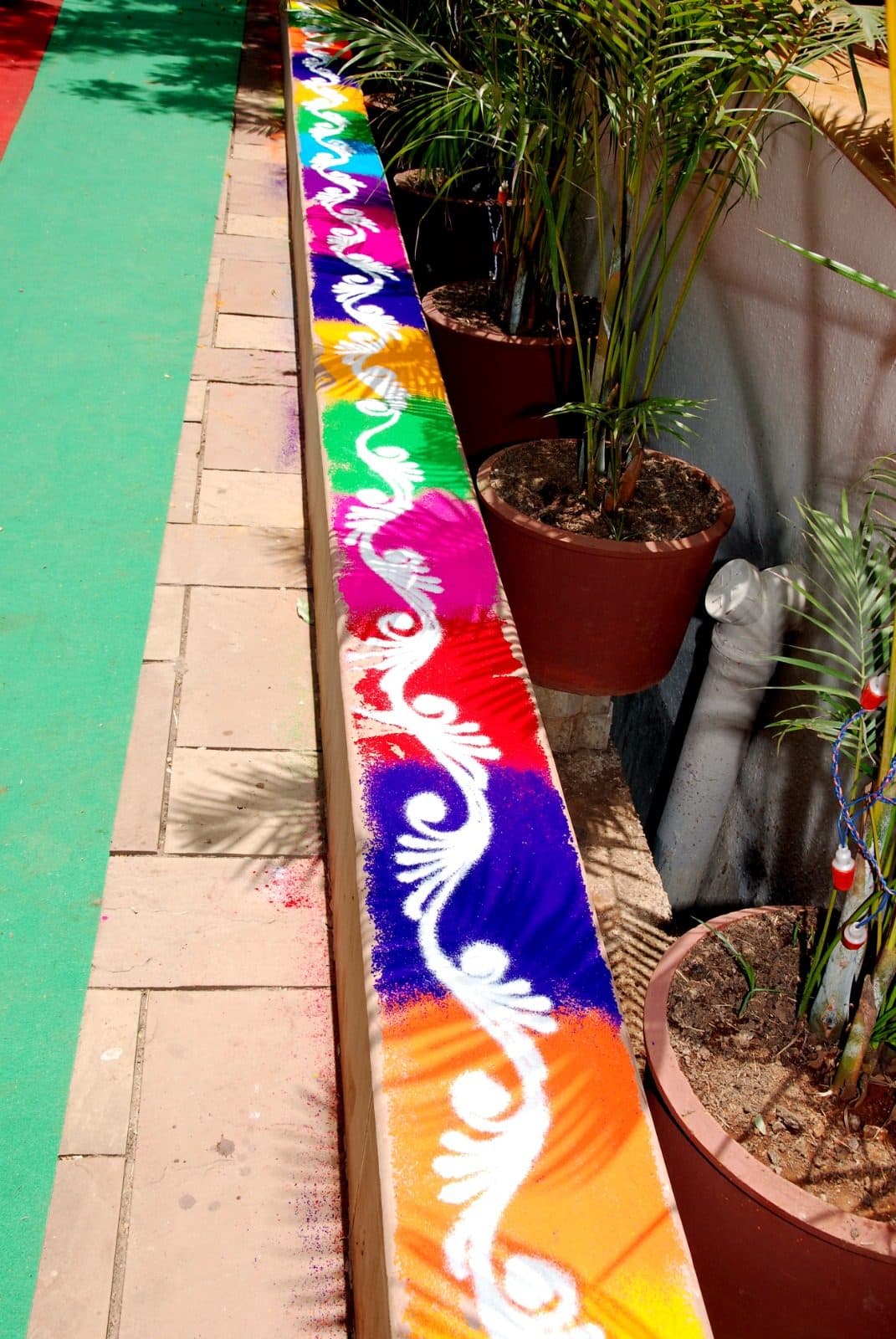 Resort Grounds — Colorful Sand Rangoli Pathway Border