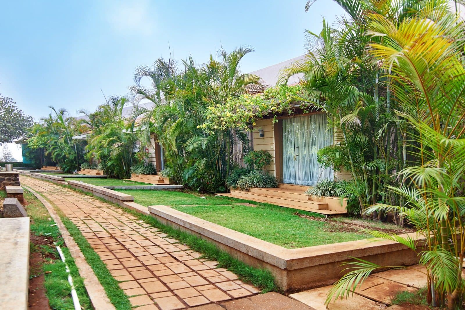 Resort Grounds — Cottage Garden Pathway Palm Trees