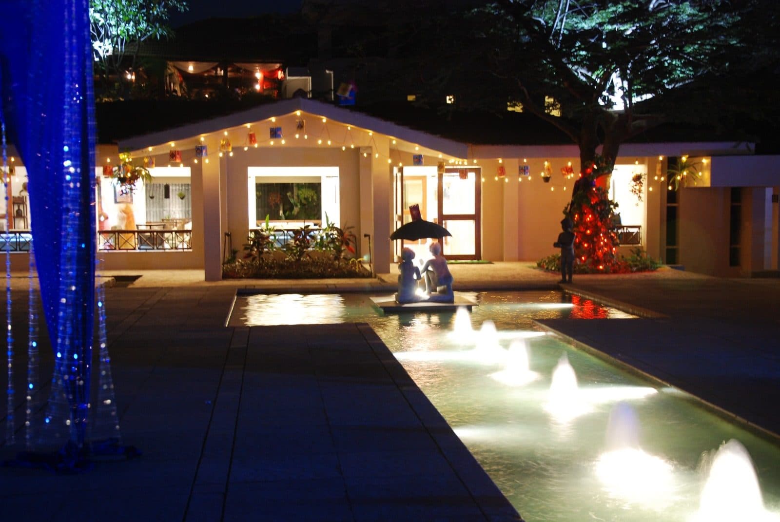 Resort Grounds — Courtyard Fountain Cottages String Lights