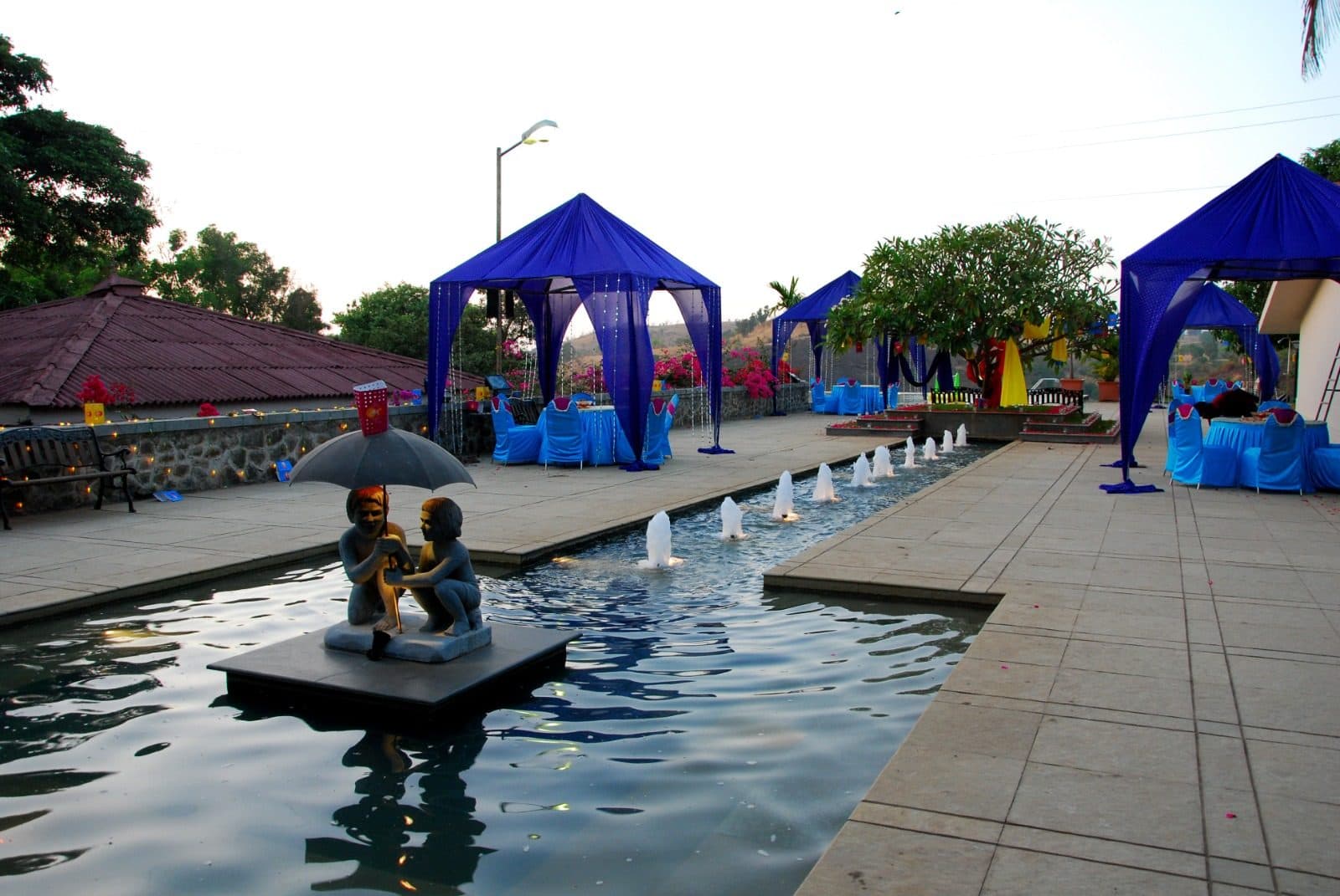 Resort Grounds — Fountain Walkway Blue Cabanas Sunset View