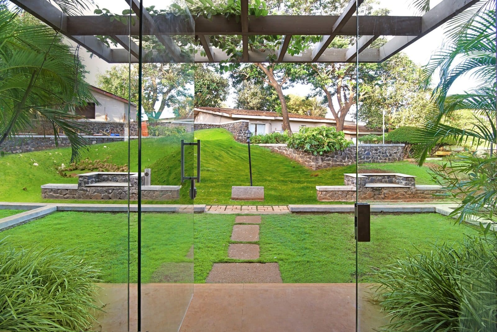 Resort Grounds — Landscaped Courtyard Lawn Stone Benches