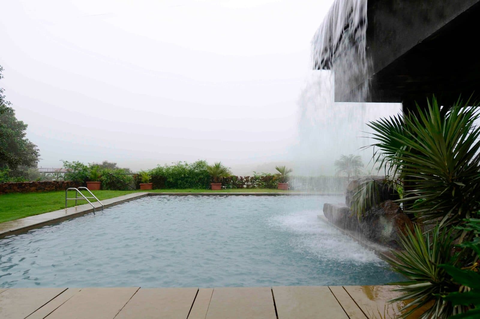 Infinity Pool — Outdoor Pool Cascading Waterfall Misty Valley