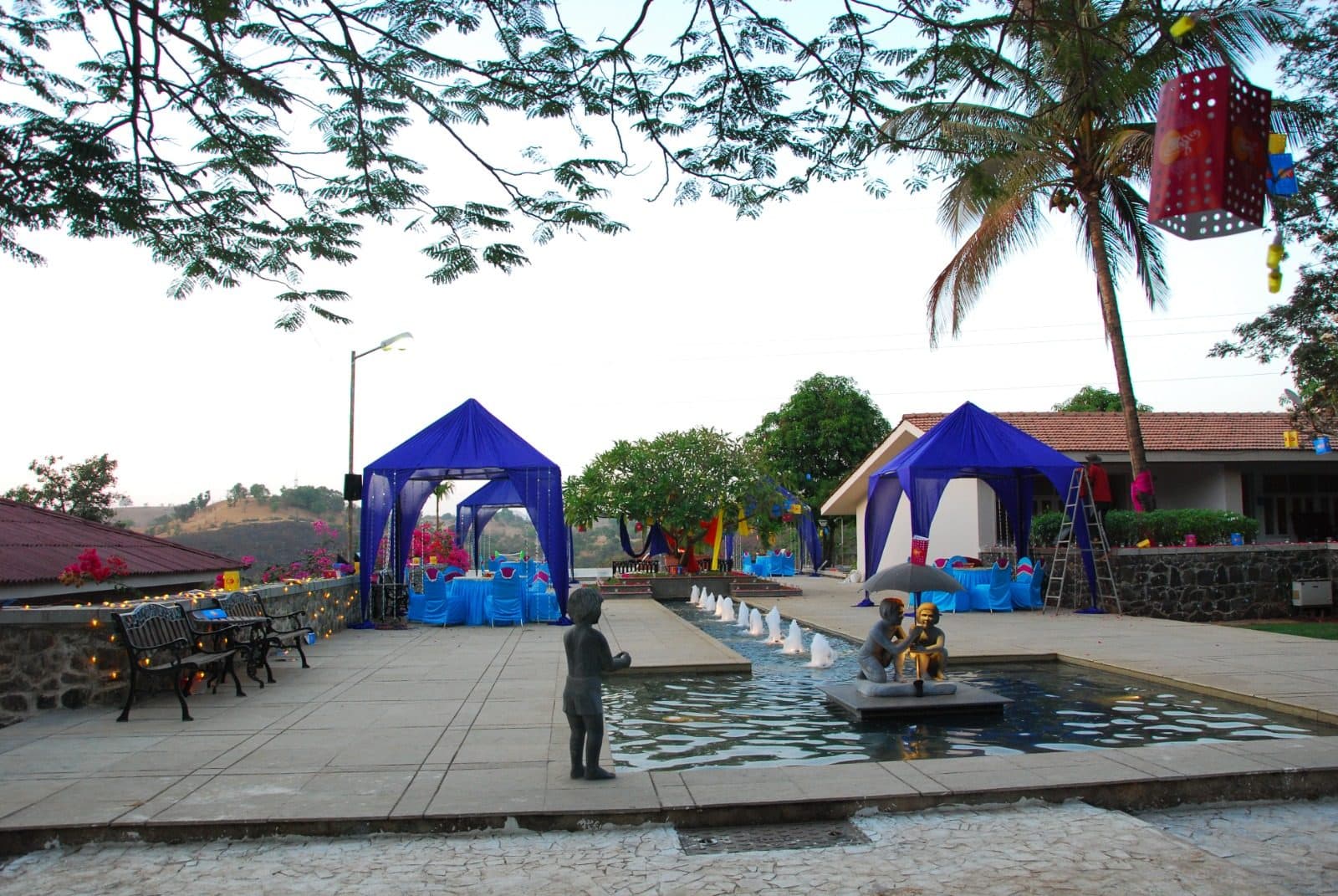 Infinity Pool — Poolside Fountain Cabana Lawn Dusk